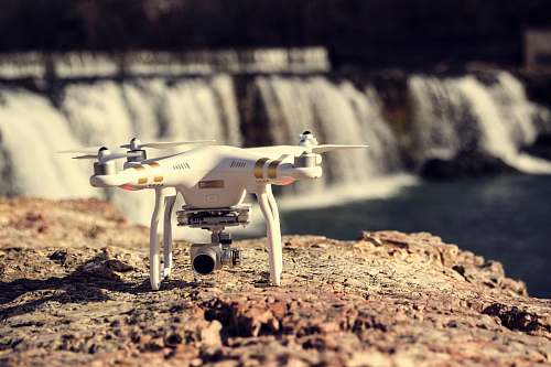rocks white and gold DJI Phantom Professional quadcopter rock