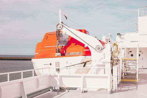 france white ship on body of water during daytime orange