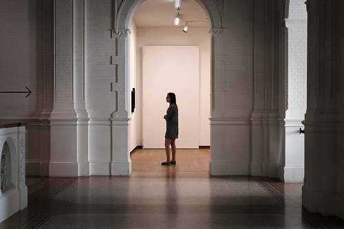 quiet woman standing at the center of arch thought