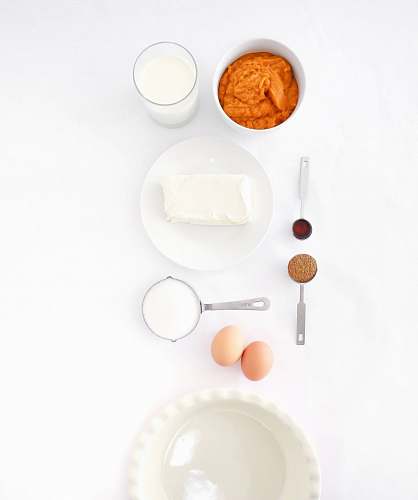 white assorted ingredients on white table igredients