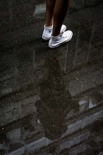 clothing woman wearing pair of white Converse sneakers shoe