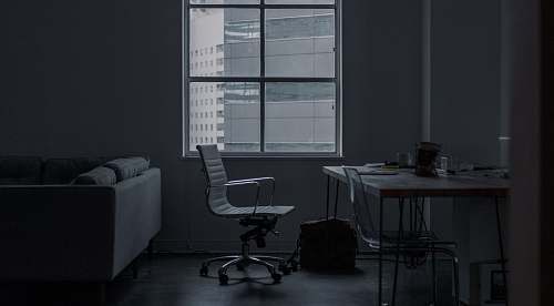 chair white rolling armchair in front of table couch