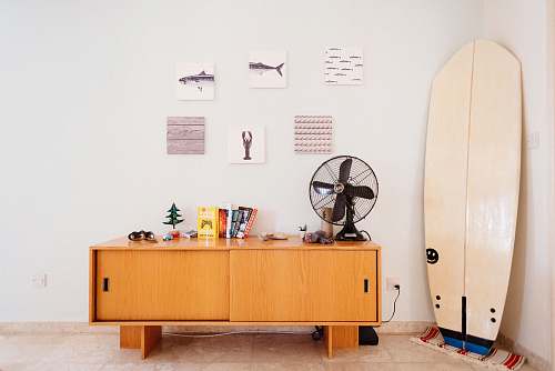germasogeia white surfboard beside brown wooden credenza cyprus