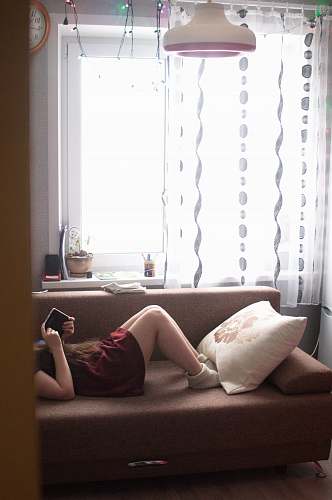 couch woman lying on sofa indoors