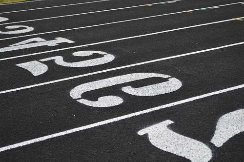 tarmac aerial view photography of number on ground asphalt