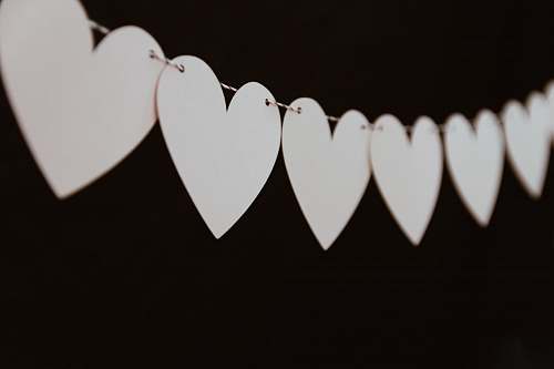 love closeup photo of white heart bunting valentine