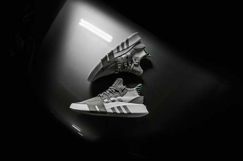 black-and-white grayscale photo pair of adidas shoes trademark