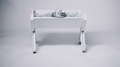 christmas grayscale photography of tiara on table manger