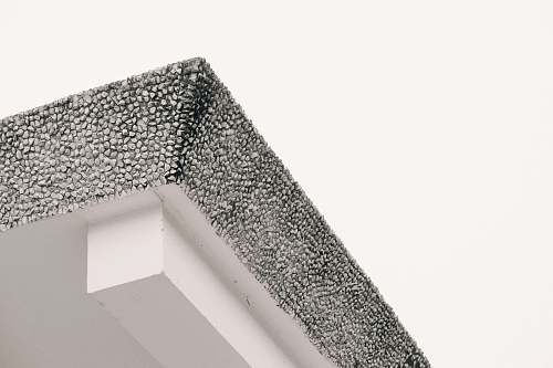 building low angle photo of ceiling triangle