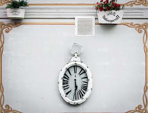 clock oval white analog clock display at 6 o'clock gold