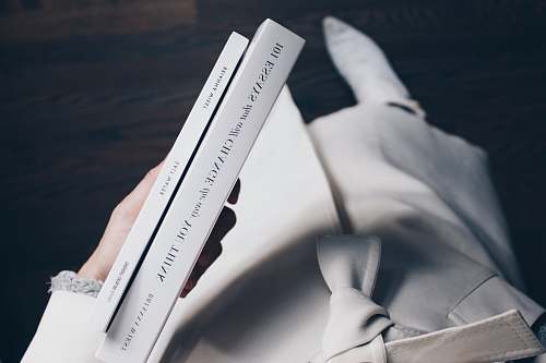 book person holding books holding