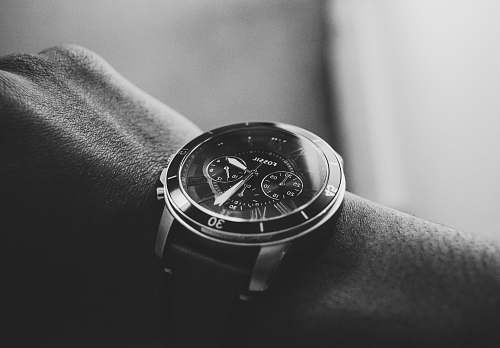 black-and-white person wearing chronograph watch wristwatch