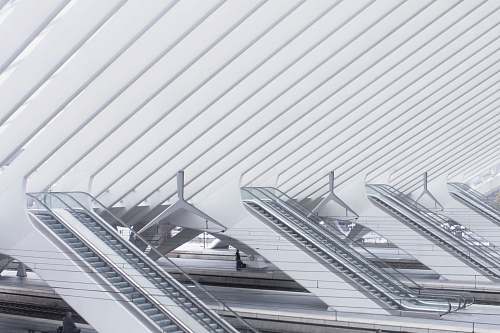 building photo of white escalators liège