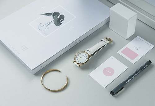 white round gold-colored analog watch with white band london