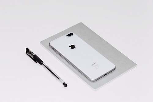 warsaw silver iPhone X beside black ballpoint pen poland