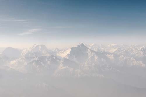 mountain snow cap mountains under blue sky at daytime mountain range