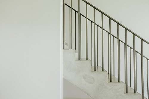 banister staircase with gray steel rail handrail