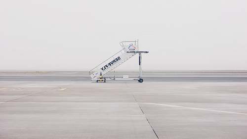 weeze white airliner stairs on runway airplane