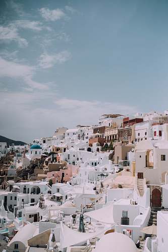 greece white and brown building oia