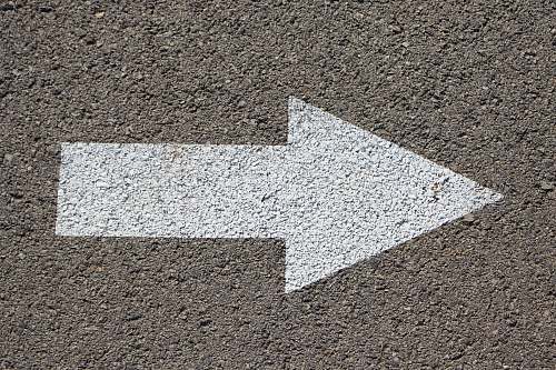 arrow white arrow road sign pavement