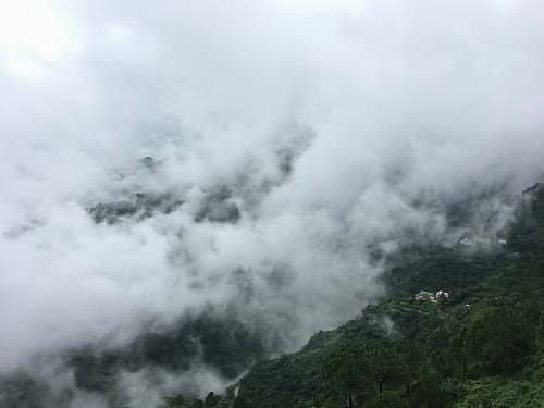 mountain white clouds over a mountain fog
