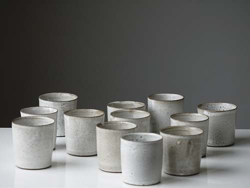 pottery white cup lot on white surface white