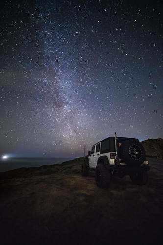 vehicle white Jeep Wrangler under starry sky jeep