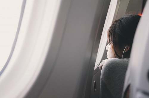 asleep woman looking plane mirror plane