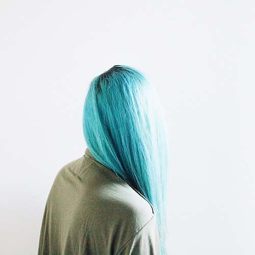 blue teal-haired woman wearing brown top woman