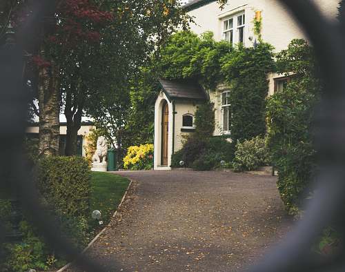 building minimalist photography of house shot in front of chain fence cottage