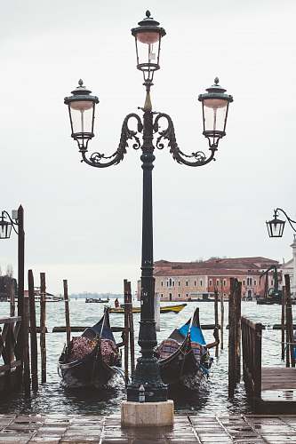 person black and gray metal lamp post lamp post