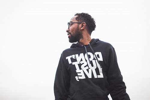 person low angle photography of man wearing black hoodie people