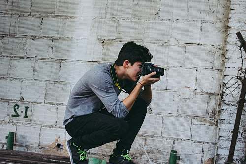 people man holding camera person