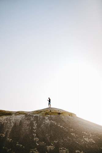nature person standing on top of mountain] outdoors