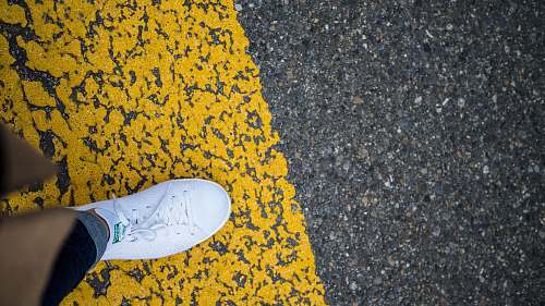 people person wearing white adidas Stan Smith shoe person