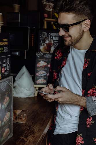 person unknown person using smartphone indoors accessories