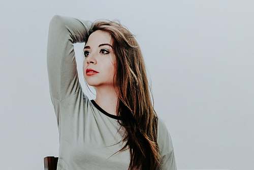 person woman raising her left arm people
