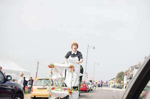person woman riding white and green cart people