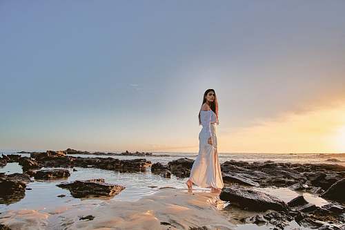 person woman standing on body of water people
