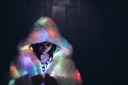 person woman wearing lighted furry coat people