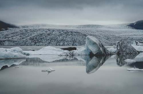 grey ice berg on body of water glacier