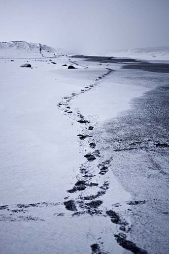 vik photography of feet print on through mountain tracks