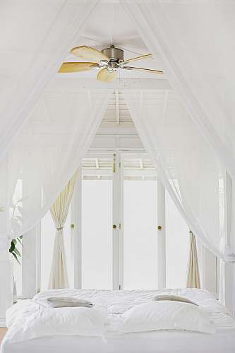 home bed sheet near glass window bedroom