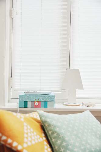 home white wooden lampshade near window blinds blinds