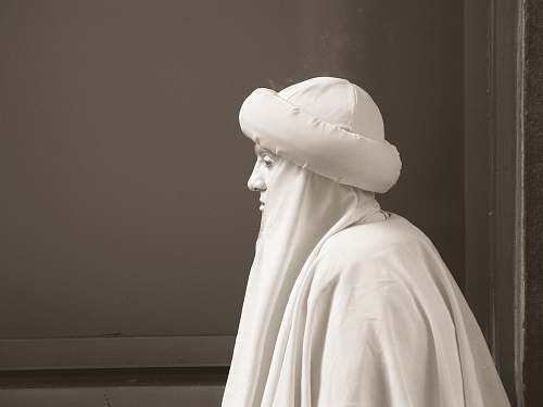 art man in white garments piazza san marco