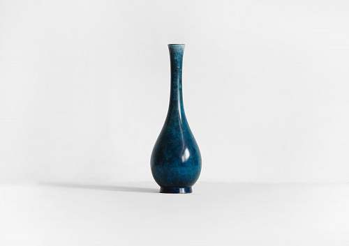 vase photography of blue ceramic vase against white background pottery