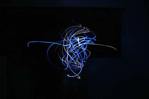 neon blue and white light streaks sphere