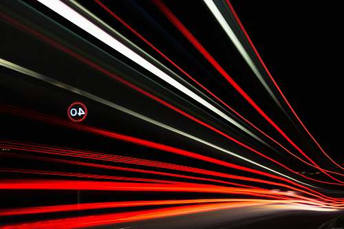 motion long exposure photography of red and white lights night