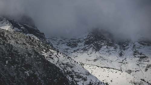 alps aerial photography of fog covering mountain top nature