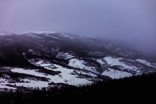 outdoors aerial photography of snowfield under white clouds nature